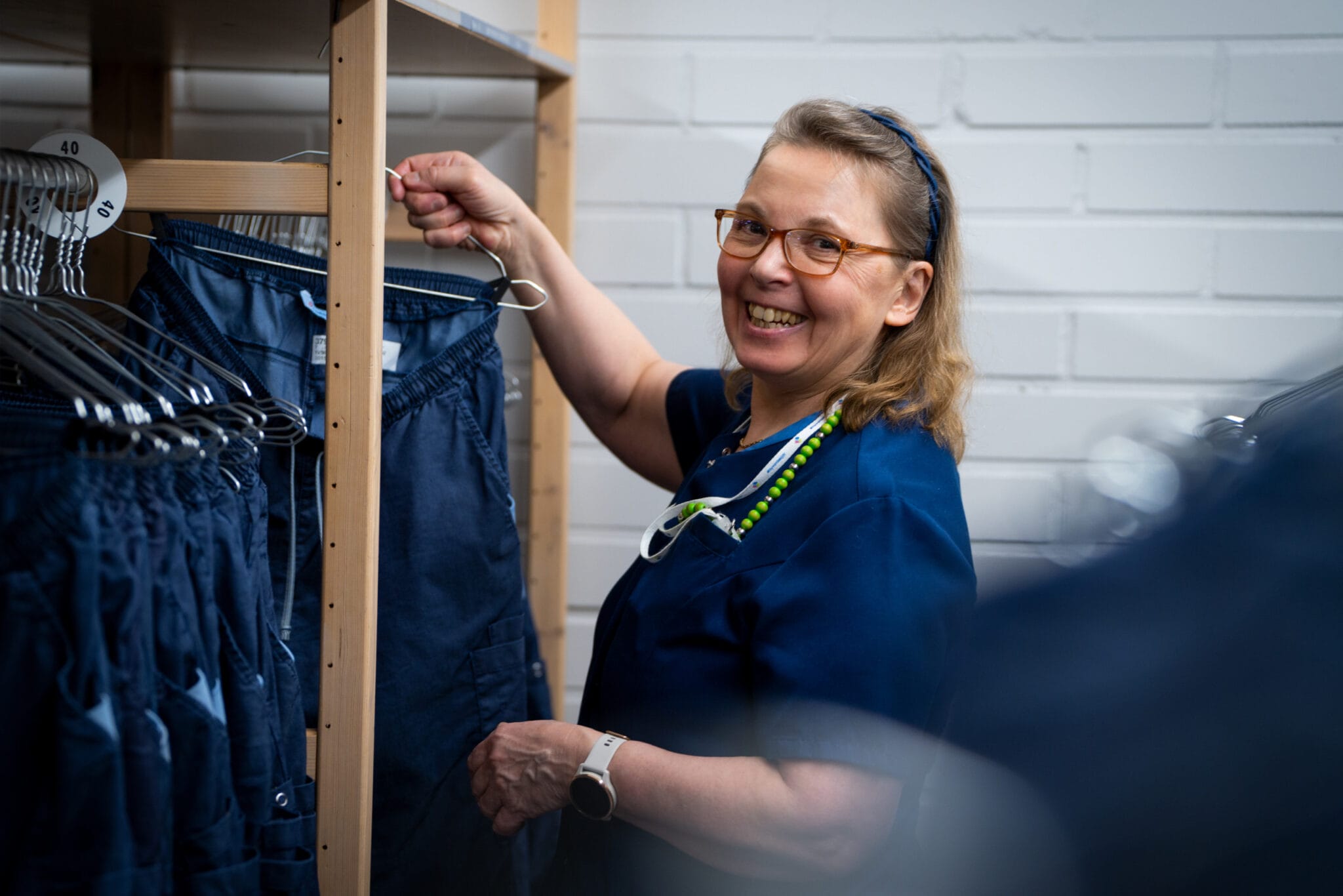 Employee fetching workwear from the workwear flex storage room.