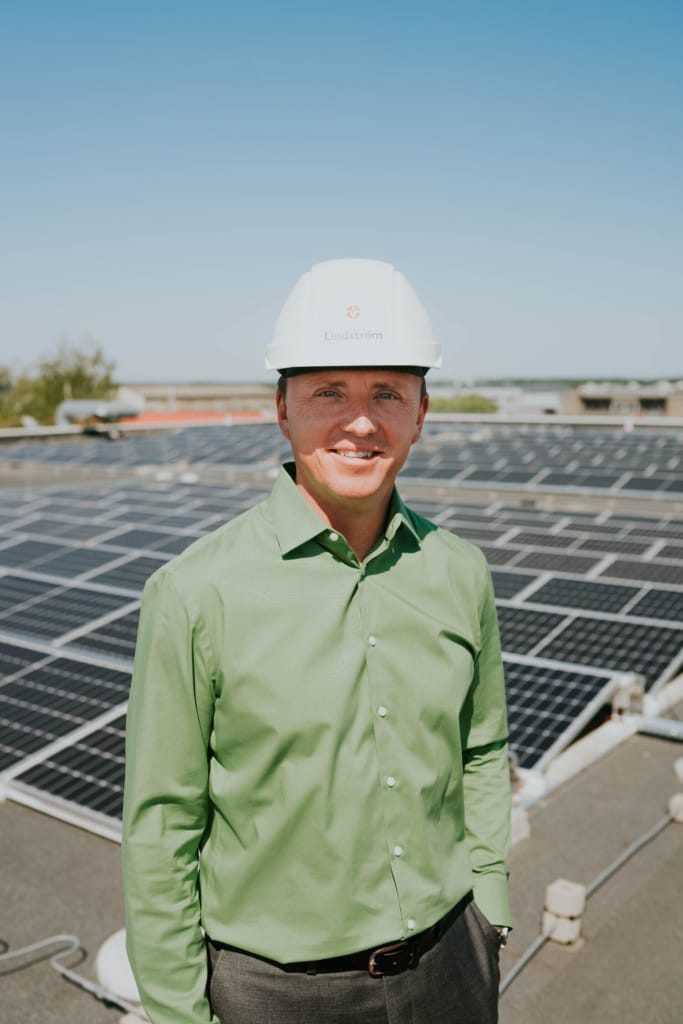 Ivars Šmits, MD Lindström Latvia showing solar panels on the roof of service centre Pinki.